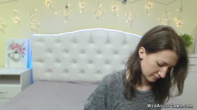 Sexy brunette caresses her chest on webcam