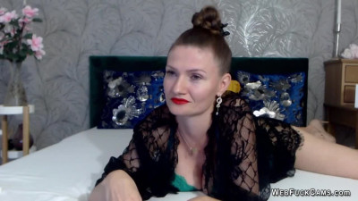 Busty Romanian MILF oiling tits closeup on webcam show