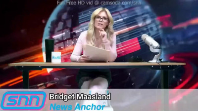Bridget Maasland behiind the desk