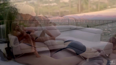 Xandra Sixx and Cadence Lux on a white leather sofa in a lesbian scene together